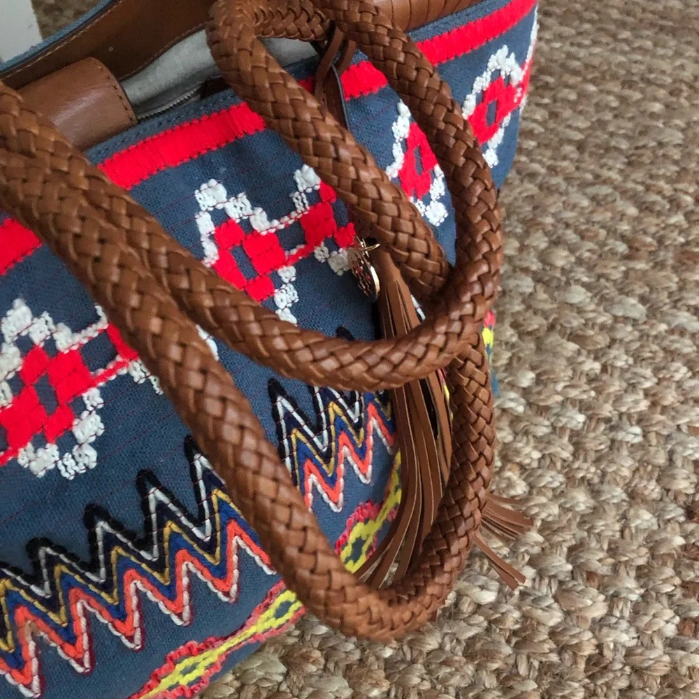 Tory Burch measured approximately